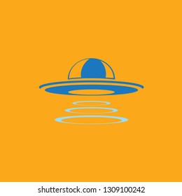 Blue Ufo flying saucer vector icon isolated on orange background. Ufo logo design template 