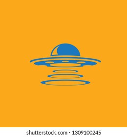 Blue Ufo flying saucer vector icon isolated on orange background. Ufo logo design template 