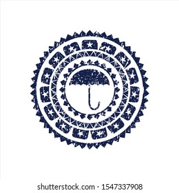 Blue umbrella icon inside distressed rubber grunge texture seal