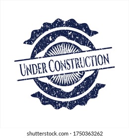 Blue Under Construction rubber seal with grunge texture. 