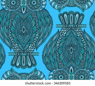 Blue vector seamless pattern with beautiful hand drawn ornate owls on branches.