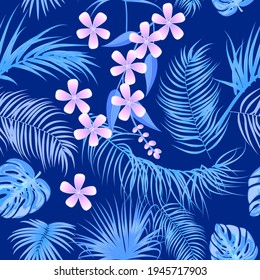 Blue vector tropical seamless pattern with  leaves of palm tree and flowers. Jungle  background, wallpaper.