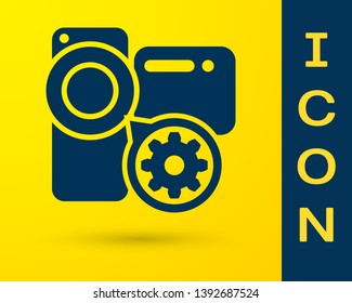 Blue Video camera and gear icon isolated on yellow background. Adjusting app, service concept, setting options, maintenance, repair, fixing. Vector Illustration