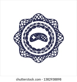 Blue video game icon inside rubber grunge stamp
