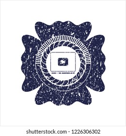 Blue video player icon inside rubber grunge texture stamp