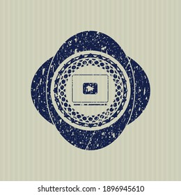 Blue video player icon inside rubber grunge texture stamp. 