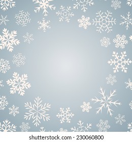 Blue vintage background with round space for text and snowflakes. Can be used as greeting card for Christmas and new year