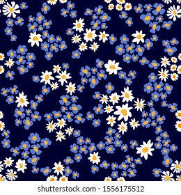	
Blue violas and chamomiles fields. Trendy fabric pattern with miniature flowers. Botanical seamless print with different floral elements. Vintage textile collection.