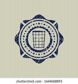 Blue wastepaper basket icon inside distressed rubber grunge texture stamp