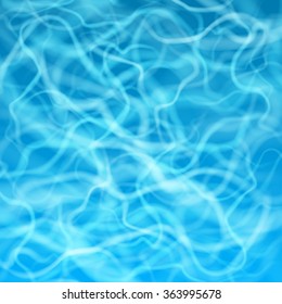 Blue water surface with flecks of sunlight
