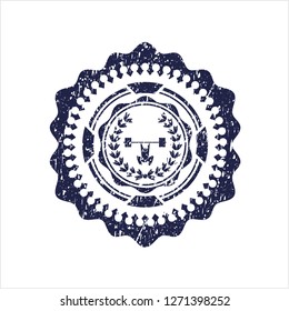 Blue weightlifting inside of crown icon inside distressed rubber grunge texture stamp