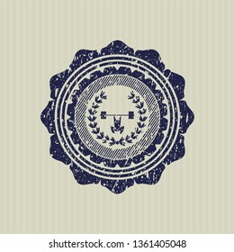 Blue weightlifting inside of crown icon inside distressed rubber seal