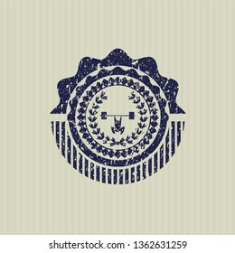 Blue weightlifting inside of crown icon inside distressed grunge style stamp