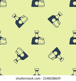 Blue Whiskey bottle and glass icon isolated seamless pattern on yellow background.  Vector