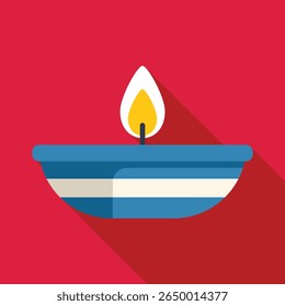 Blue and white candle is burning brightly, providing a warm and inviting glow