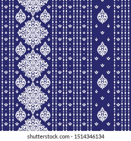 Blue and white floral seamless pattern with ornamental stripes. Traditional oriental motifs. Vintage ornament template. Decorative paisley elements. Great for fabric and textile.