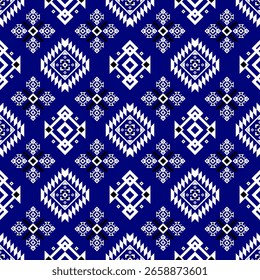 Blue and white geometric tribal pattern featuring diamond shapes and intricate symmetrical motifs in a repeating design.