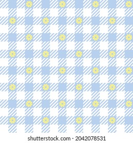 Blue and white gingham with yellow flowers. Seamless vector embroidered plaid pattern. Seamless vector check pattern suitable for fashion, home decor and stationary.