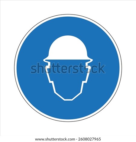 Blue and white mandatory sign indicating the requirement of wearing a hard hat or safety helmet for head protection in construction sites or industrial areas.