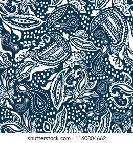 Blue and white print. Seamless vector pattern with paisleys, leaves, flowers and other floral elements inspired by Indian folk art. Ethnic textile collection.