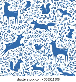 Blue and white seamless Christmas pattern with forest animals and floral elements.