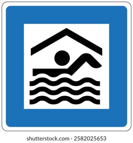 Blue and white square road sign indicating an indoor swimming pool with a person swimming.