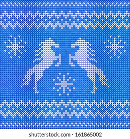 Blue and white "sweater with horses" seamless pattern