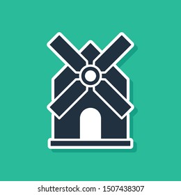 Blue Windmill icon isolated on green background.  Vector Illustration
