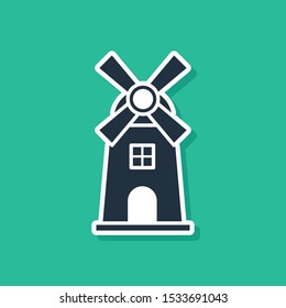 Blue Windmill icon isolated on green background.  Vector Illustration