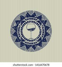Blue wine cup icon inside distressed grunge stamp