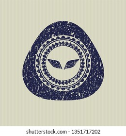 Blue wings icon inside distress rubber grunge texture stamp