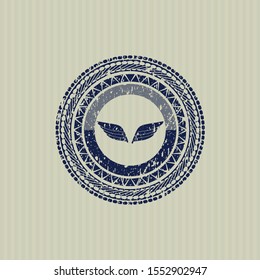 Blue wings icon inside distress rubber stamp