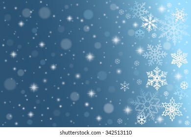 Blue winter background with falling snowflakes