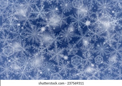 Blue winter background made from snowflakes.