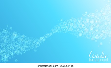 Blue winter background. Set of light snowflakes on blue background. Snowflakes abstract wave for your Christmas design. There is place for your text.