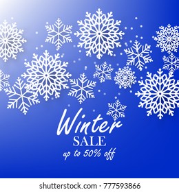Blue winter background with white snowflake sale banner