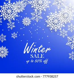 Blue winter background with white snowflake sale banner