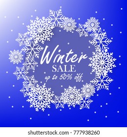 Blue winter background with white snowflake sale banner