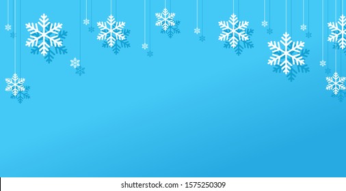 Blue winter horizontal background with snowflakes for web banner and mailing.