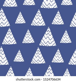 Blue winter seamless pattern with white snowy striped geometric tree shapes. Abstract Christmas vector texture with hand drawn elements for textile, wrapping paper, surface, background, wallpaper