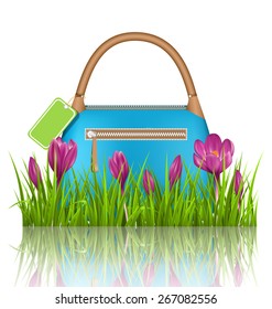 Blue woman spring bag with crocuses flowers and sale label in grass lawn with reflection on white background