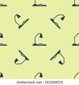 Blue Workplace with table lamp and open book icon isolated seamless pattern on yellow background. Table office lamp.  Vector Illustration
