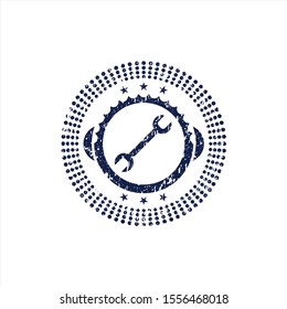 Blue wrench icon inside rubber grunge seal