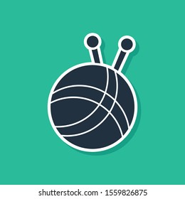 Blue Yarn ball with knitting needles icon isolated on green background. Label for hand made, knitting or tailor shop.  Vector Illustration