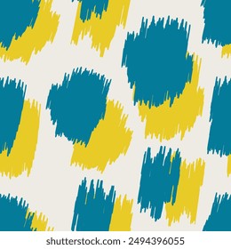 Blue and yellow spots with jagged edges form a leopard spotted seamless pattern for modern decorative pillows, wrapping paper, fabrics. Vector.