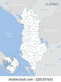 Blue-gray detailed map of Albania administrative divisions and location on the globe. Vector illustration