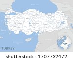Blue-gray detailed map of Turkey and administrative divisions and location on the globe. Vector illustration