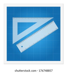Blueprint and ruler instruments on a white background.