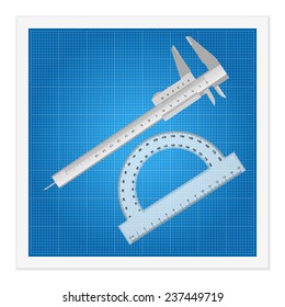 Blueprint and ruler instruments on a white background.