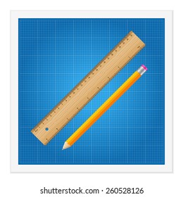Blueprint and ruler instruments on a white background.